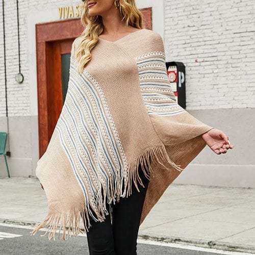 Etninen poncho tupsuilla