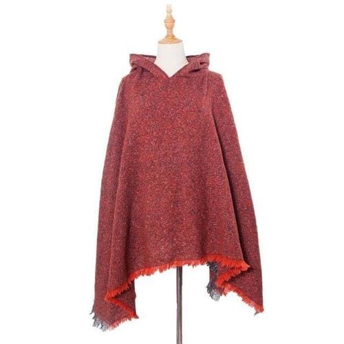 Pitkä kirjava naisten poncho