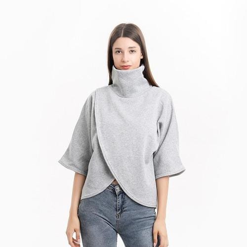 Ruudullinen naisten poncho pystypääntiellä
