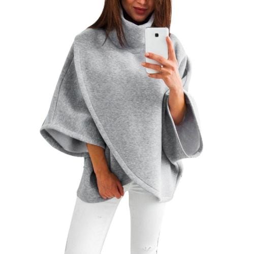 Ruudullinen naisten poncho pystypääntiellä