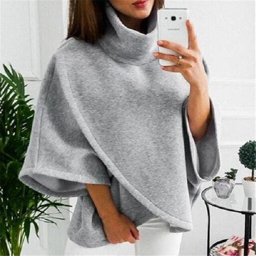 Ruudullinen naisten poncho pystypääntiellä