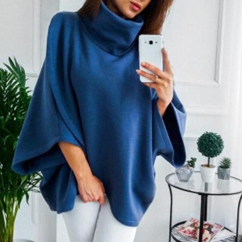 Ruudullinen naisten poncho pystypääntiellä